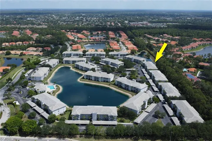 View of property location with a large body of water and nearby suburban area