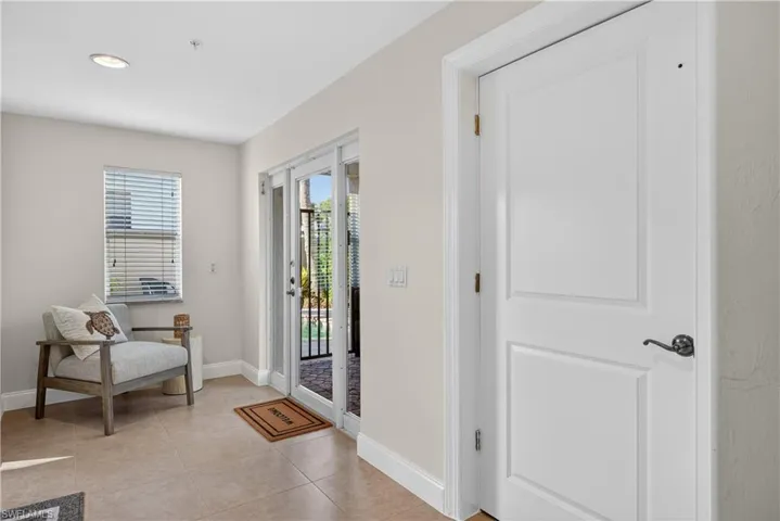 Foyer featuring baseboards and light tile patterned flooring