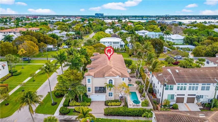 Aerial view of residential area featuring a pool area