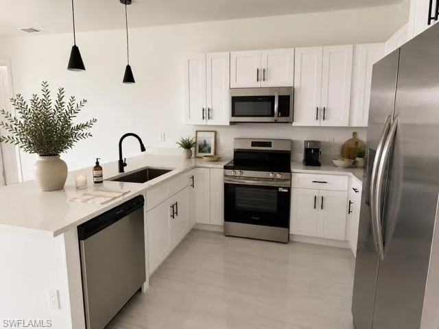 Angle 2- Functional kitchen offering generous prep space and an open layout ideal for entertaining.