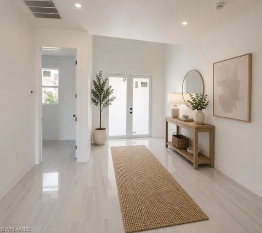 Inviting foyer with abundant natural light and elegant finishes.