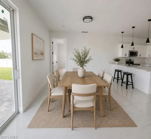 Bright dining area overlooking the backyard with easy access to the kitchen.