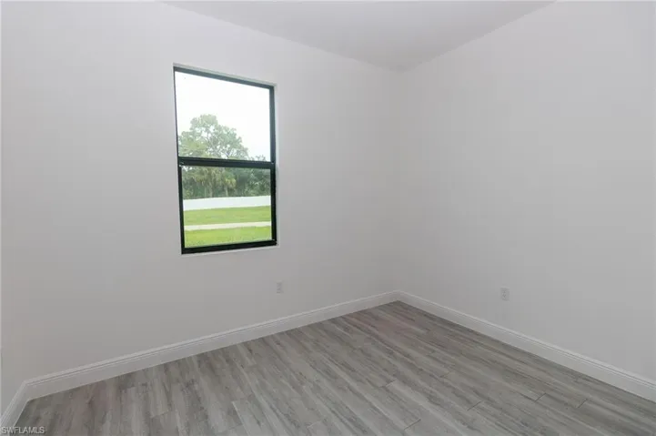 Bedroom featuring vinyl flooring