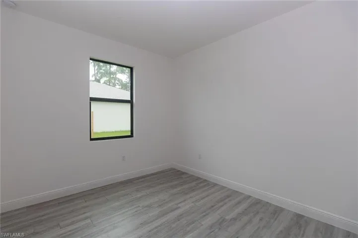 Bedroom featuring vinyl flooring