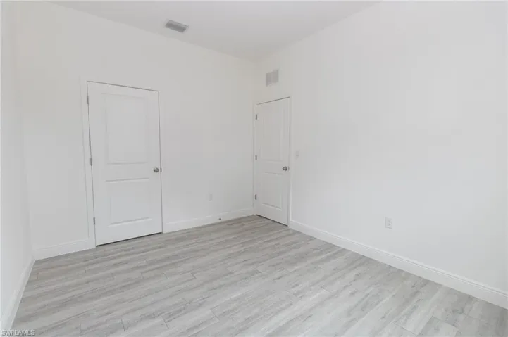 Bedroom featuring vinyl flooring