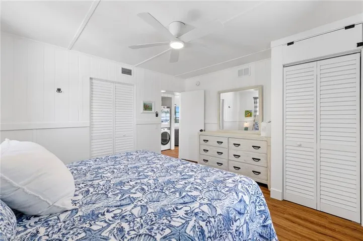 Bedroom featuring ceiling fan and hardwood / wood-style flooring