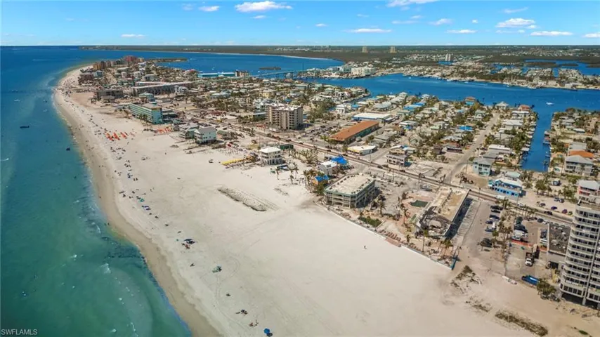 Bird's eye view with a water view and a beach view