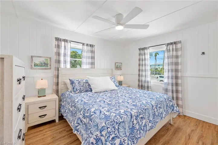 Bedroom with light wood-type flooring and ceiling fan