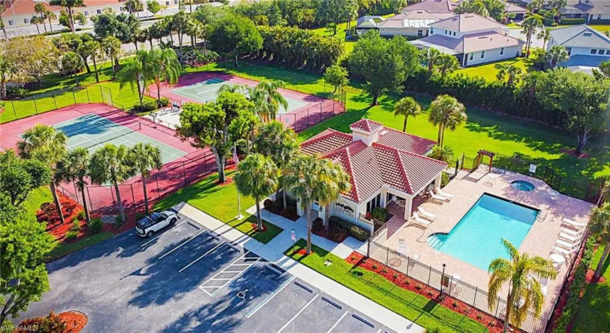 Aerial view of residential area featuring a pool