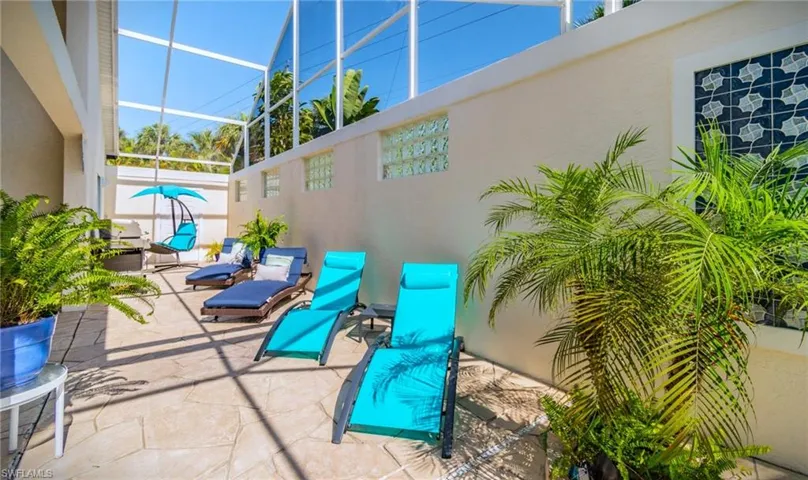 View of patio / terrace featuring a sunroom