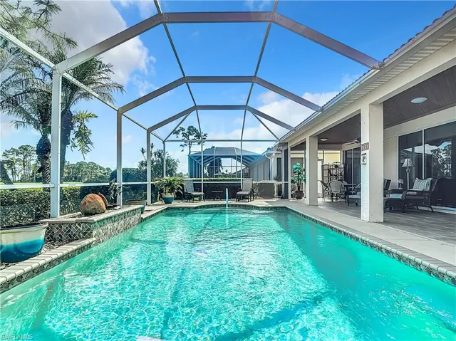 View of pool featuring a lanai and a patio area