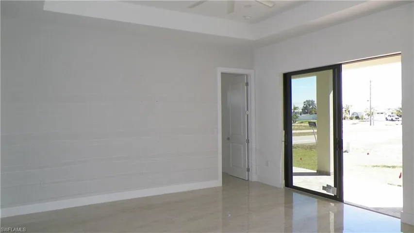 Empty room with baseboards and ceiling fan