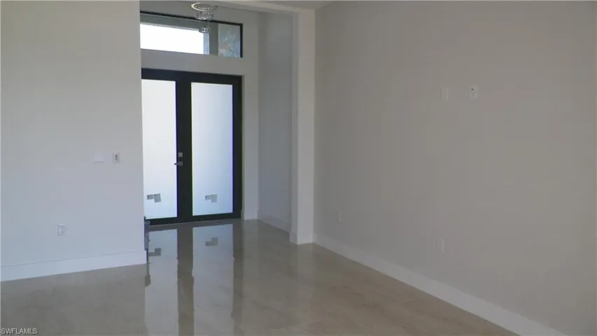 Foyer entrance featuring baseboards