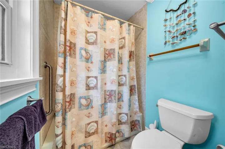 Full bath featuring toilet