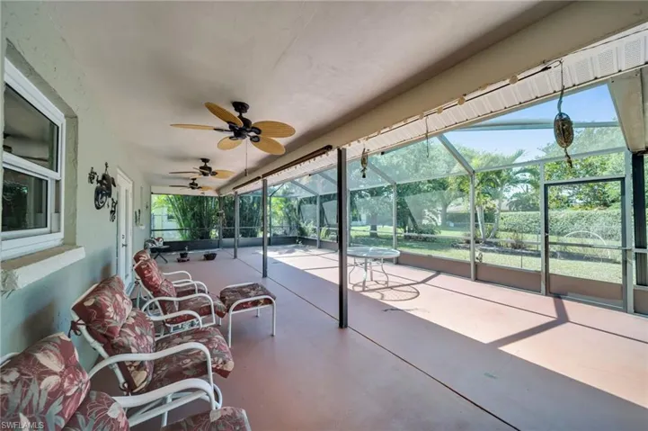 View of patio / terrace featuring a lanai and a ceiling fan