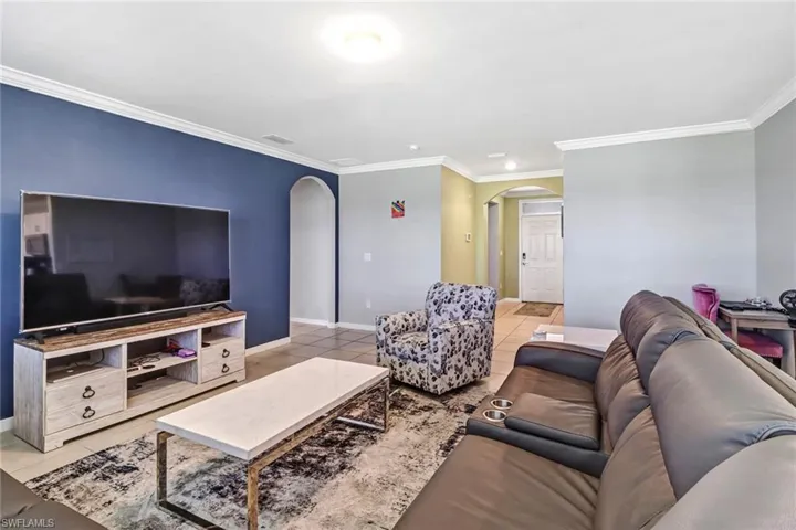 Tiled living room with ornamental molding