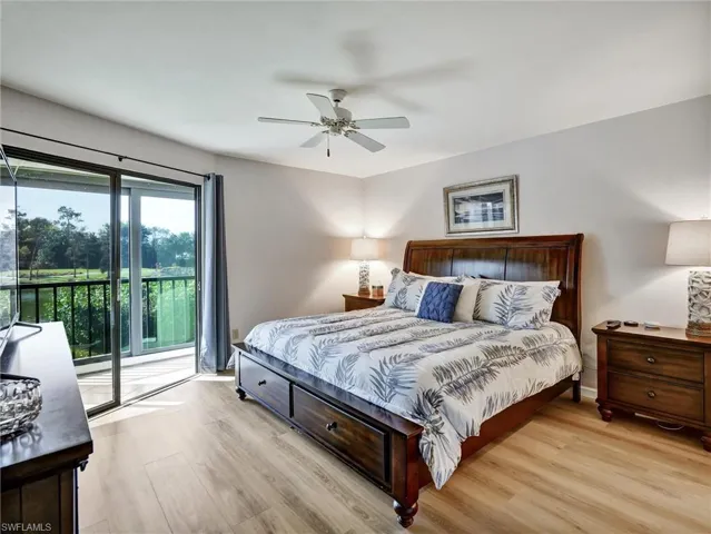 Bedroom featuring light wood-type flooring, access to outside, and ceiling fan