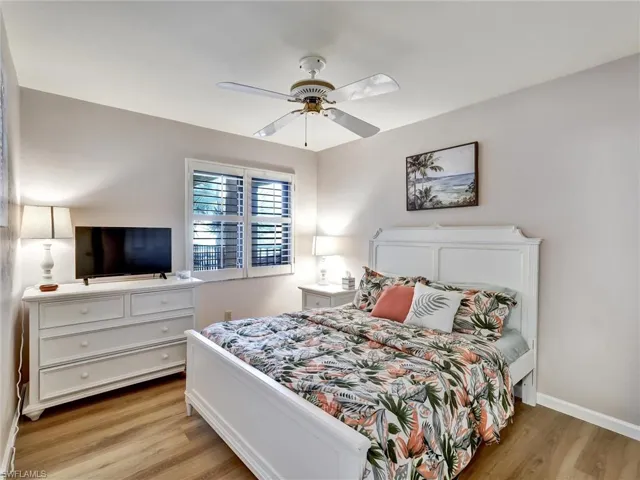 Bedroom with light wood-style floors and ceiling fan