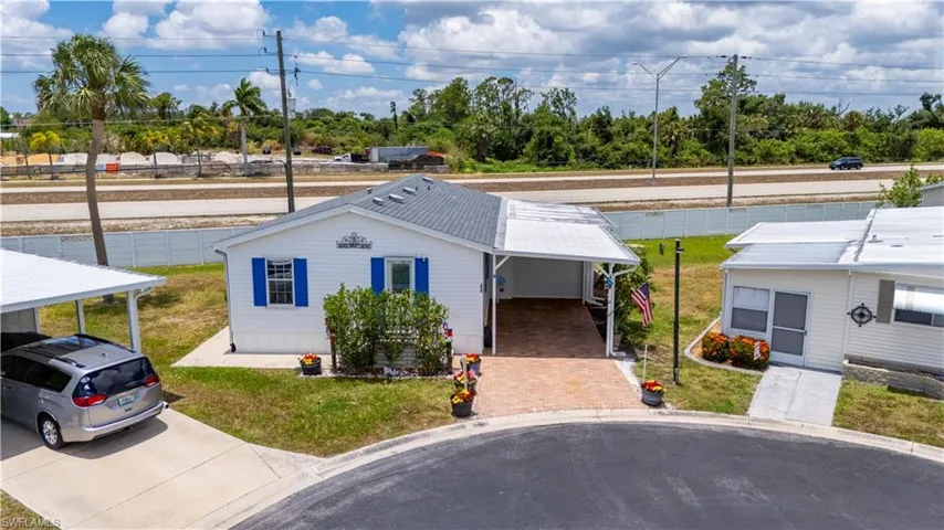 View of front of property featuring a carport