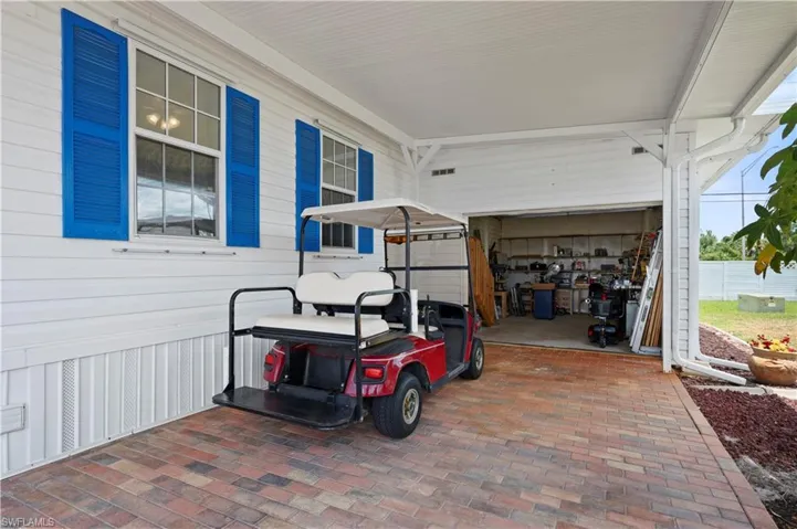 View of patio with a garage