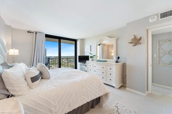 Bedroom with access to exterior and light tile patterned floors