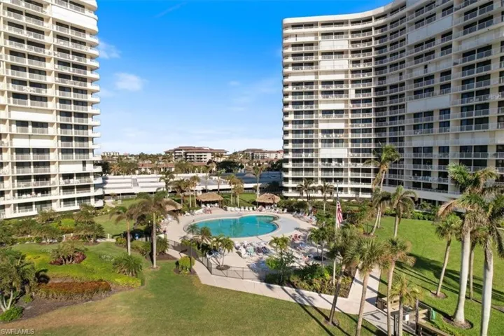 View of swimming pool with a patio area and a lawn