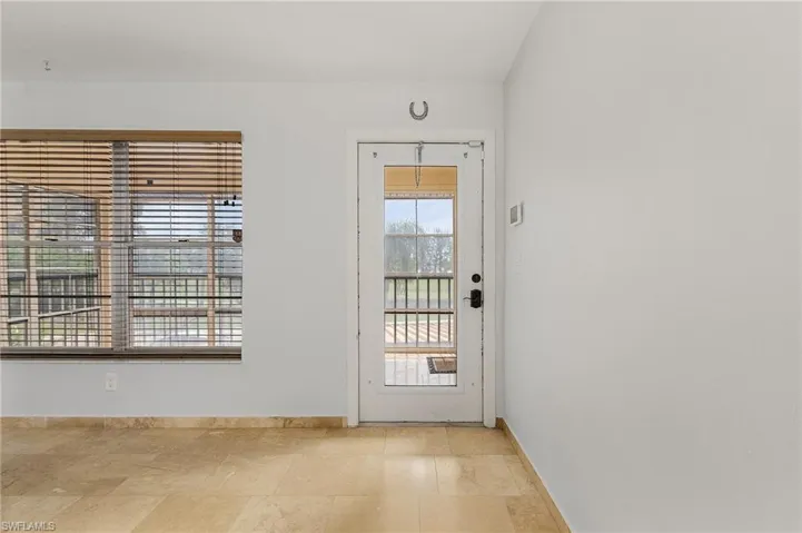 Entryway with light tile floors