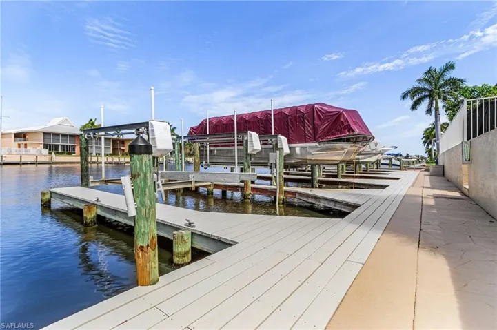 Dock area featuring a water view