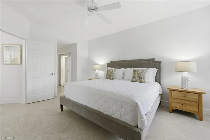 Bedroom featuring a ceiling fan and light tile patterned floors