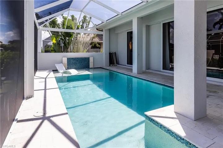 Large pool with water fountain wall