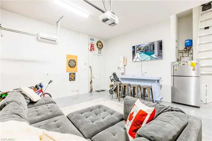 Comfy couch with television/bar/fridge