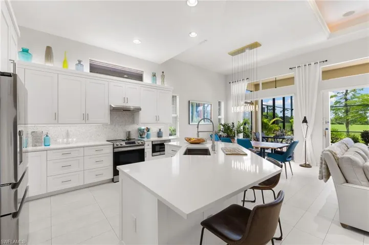 Natural light streams through the house with vaulted ceilings and oversized windows.