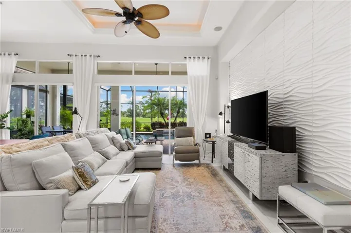 Tray ceiling with recessed lighting and built in surround sound.