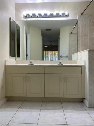Master bath vanity with raised panel cabinetry and dual sinks.