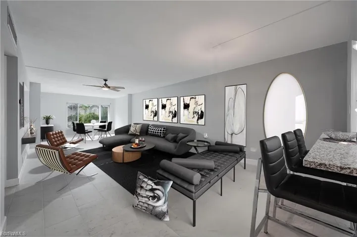 Living room with ceiling fan and baseboards