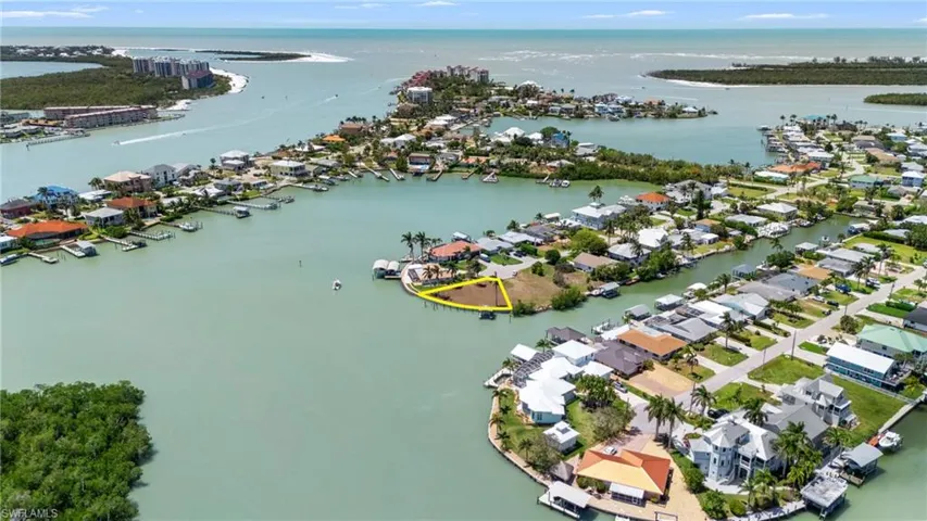 Aerial view featuring a water view and a residential view