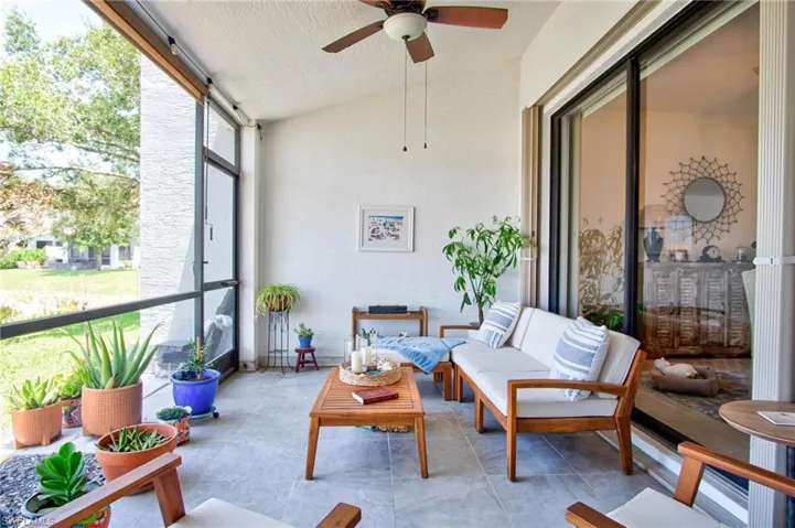 Sunroom / solarium featuring ceiling fan