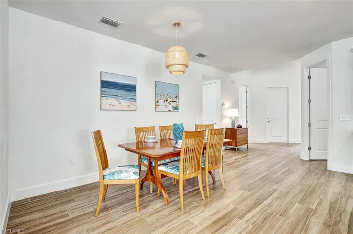 Dining space with light wood-type flooring