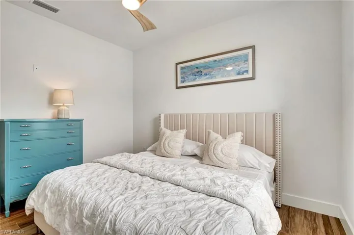 Bedroom with wood-type flooring and ceiling fan