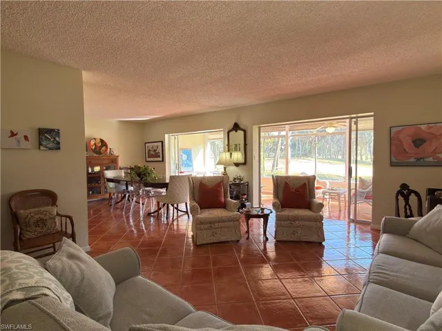 Tiled living area with a textured ceiling