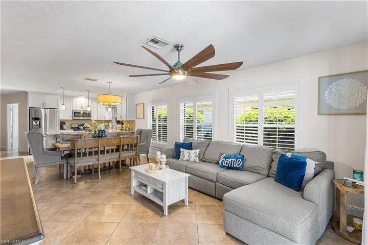 Tiled living room with ceiling fan