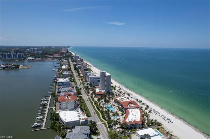 Aerial view with a beach view and a water view