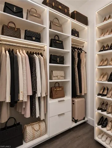 Custom closet system featuring integrated shelving, hanging rods, and drawers