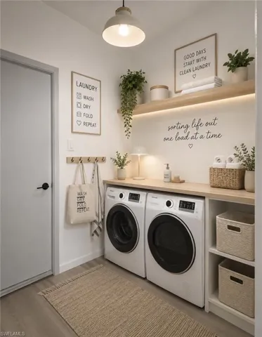 Dedicated laundry area featuring wood-finish flooring-Virtually Staged