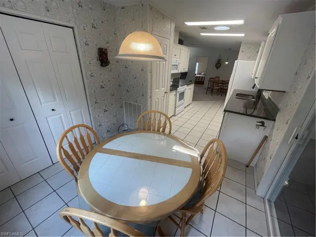 Dining room featuring light tile patterned floors