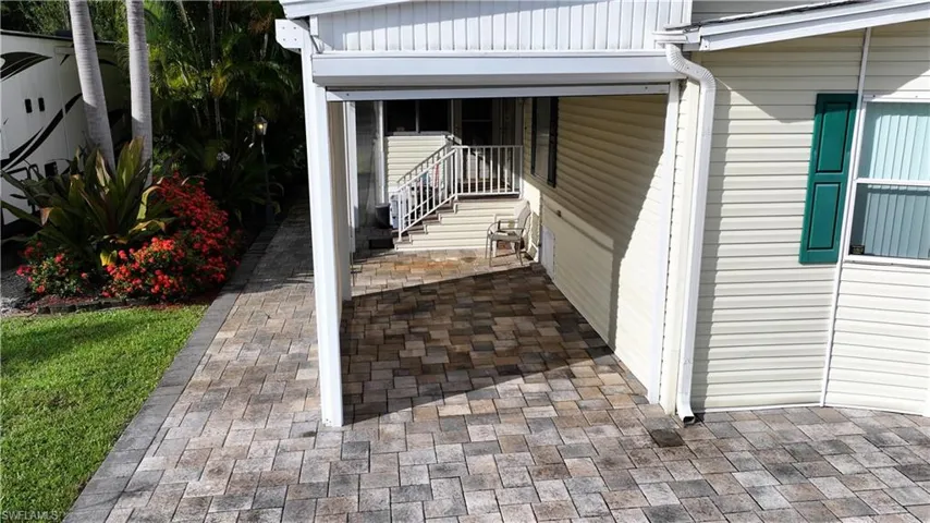 View of side of home with a patio