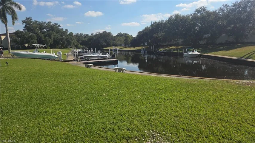 Dock with yard and a canal view