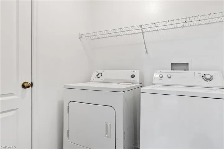 Inside Laundry Room with storage closet