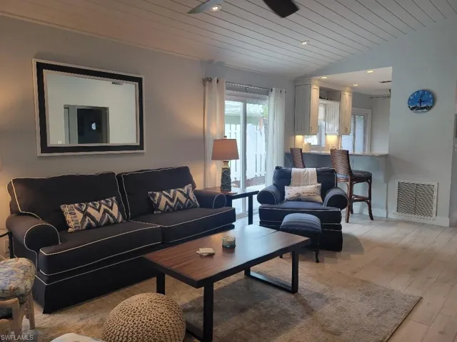 Living area featuring wood ceiling, recessed lighting, and light wood-style floors