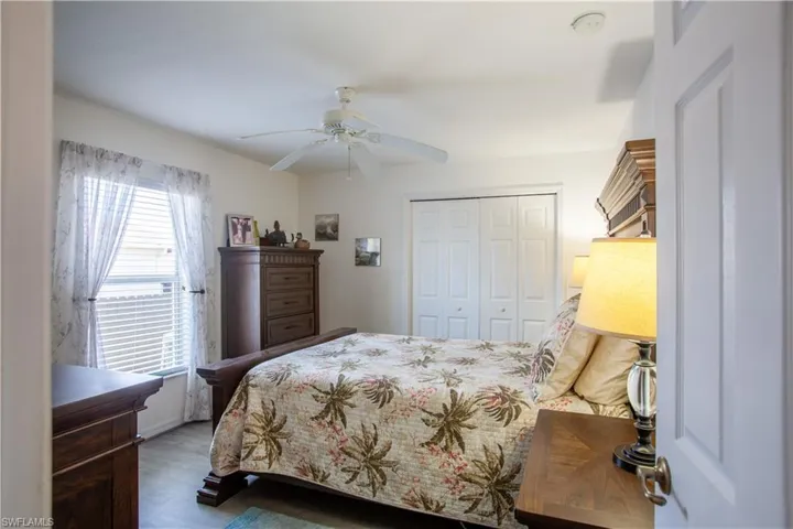 Bedroom with a ceiling fan and a closet